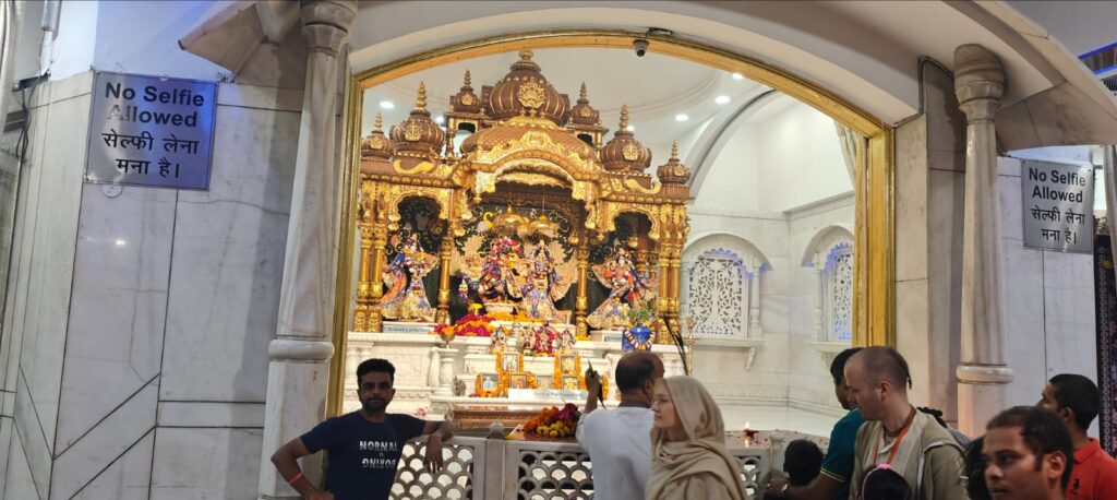 Devotees at worship, ISKCON Delhi
