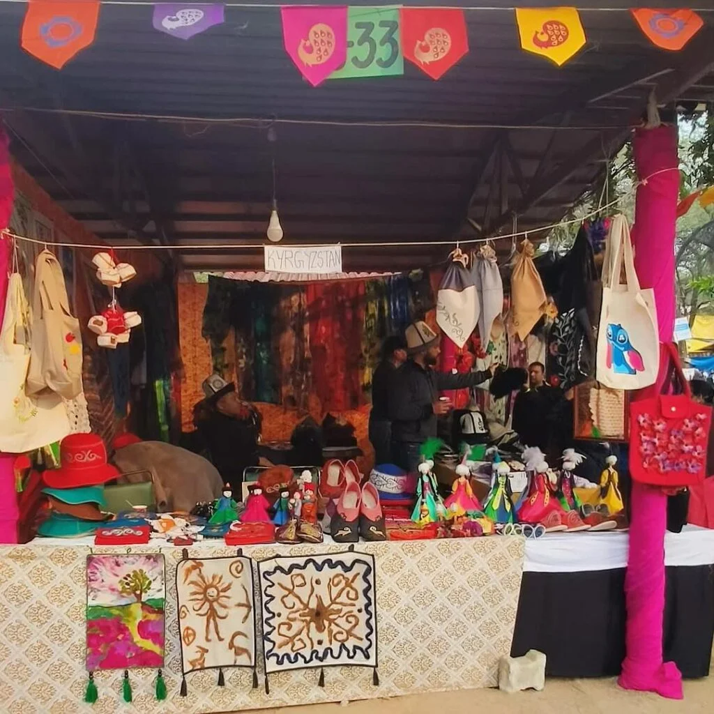Handicrafts, pottery, and tribal jewelry displayed at Surajkund Mela 2025