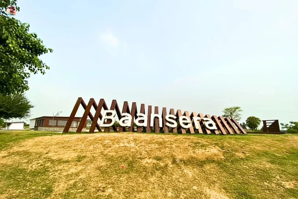 Baansera Park Delhi entrance sign on a grassy hill during my first walk