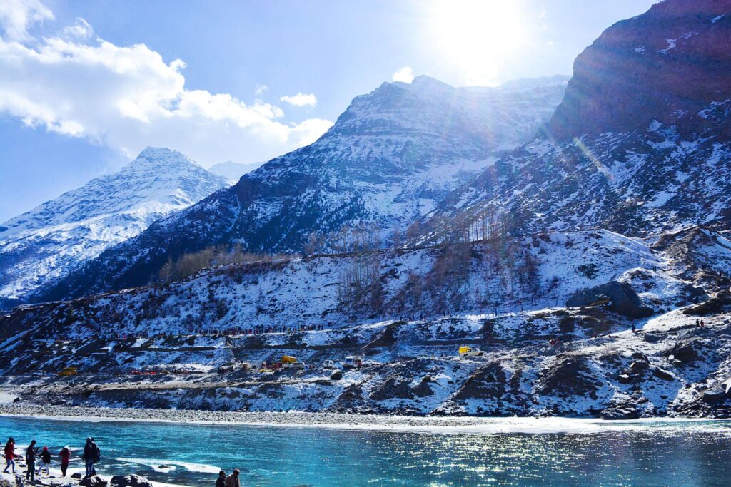 Sissu village surrounded by snow-covered Himalayan mountains.