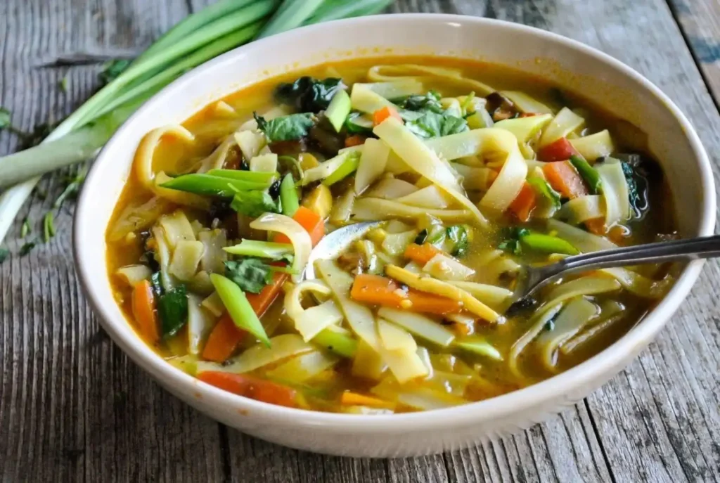 Traditional Tibetan Thukpa noodle soup with fresh vegetables